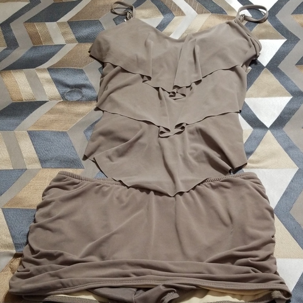 A 2 piece swim suit with skirt and pleated top